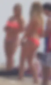 Sexy thick blonde girl with tiny bikini and big booty on the beach