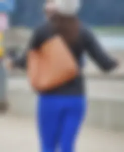 Cute girl with a nice ass in tight blue leggings along the water in San Fran