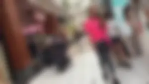 Little blonde teen in grey leggings at the mall with her friends