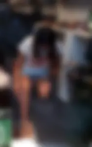 Girl in a Mask in a Skirt Flashing Her Panties While Changing Shoes
