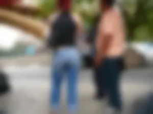 Red haired lady with a nice ass in tight jeans waiting for the bus