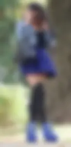 Stocky Girl on High Heels in Kitty Stockings and Blue Skirt in a City Nature Park Creepshot