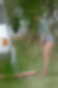 Girl getting out of her swimsuit and changing her panties while flashing pubes