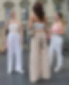 Long blonde braless in a white outfit (many pictures)