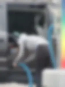 Girls cleaning their cars in jeans and pants