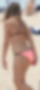 Girl in peach bikini on the beach with a great body and great ass