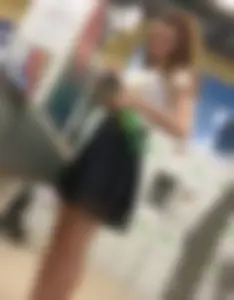 Skinny Girl in a Skirt with Sexy Legs Store Candid