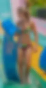 Blonde milf with a great bikini body at a water slide
