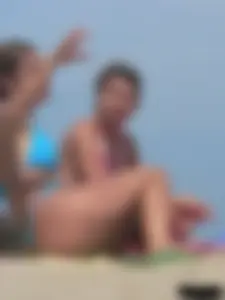 Sexy lady on the beach in a blue thong bikini