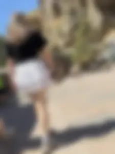 Closeups of a hot girl’s pale legs, she’s wearing a skirt