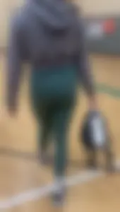Tiny Asian leaving the gym in green leggings