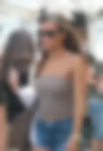 Cute girl showing her cheeks in short denim shorts