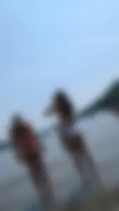 Two beautiful Girls in red and White bikini on the beach. oc