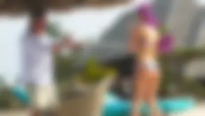 Beautiful blonde in blue thong bikini with older man exposes nipple