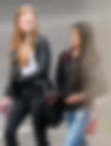 Redhead and ethnic skinny teens in tight jeans