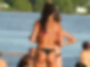 Fit girl with nice body in thong bikini on the beach