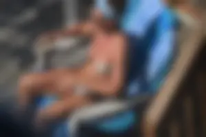 Creepshots of a neighbor milf in a bikini while sunbathing