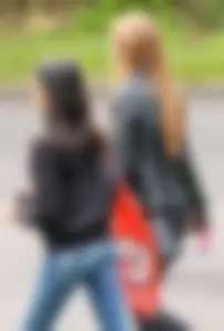 Redhead and ethnic skinny teens in tight jeans