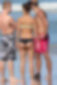 Beach girl out in a bikini with a nice round big booty