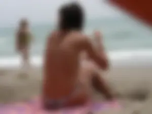 Hot topless girl on the beach in a thong bikini with a nice ass