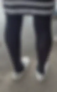 Slim legs in black pantyhose street closeups