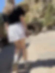 Closeups of a hot girl’s pale legs, she’s wearing a skirt