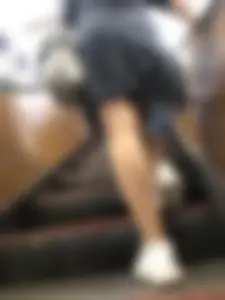 Redhead canidd milf wearing a dress on a subway escalator, hot legs