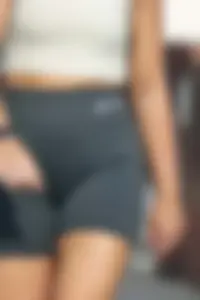 Blonde woman in lycra shorts - good front view, back view ruined by a bag