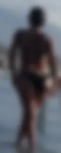 Milf with a big booty in a bikini at the beach