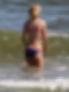 Two sexy beach teens in bikinis, one thick and one skinny with big boobs