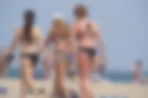 3 sexy girls with nice asses walking on the beach in bikinis