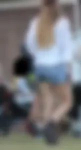 Hippie type dressed girl in denim shorts with a nice ass