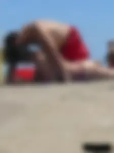 Purple thong topless lady on the beach gets oiled up by her husband