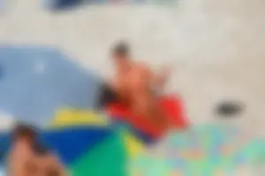 Ula FKK Sexy brunette on a nude beach topless, bottomless and with blue thong