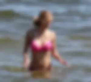 Two sexy beach teens in bikinis, one thick and one skinny with big boobs
