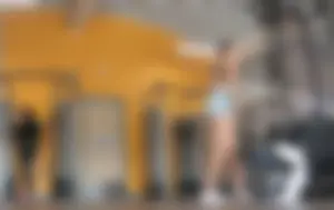 Gym brunette in tight grey shorts