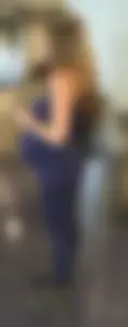 Pregnant blonde girl in leggings at the airport