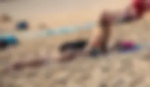 Sexy blonde laying out in black thong bikini