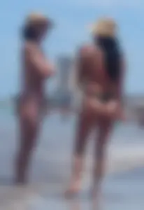 2 milfs in thong bikinis on the beach