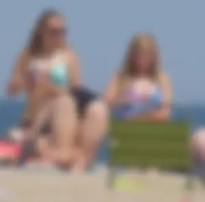 3 girls on the beach in bikinis with big boobs, one brunette and two blondes
