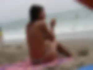 Hot topless girl on the beach in a thong bikini with a nice ass