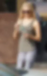 Hot blonde in light leggings after getting Starbucks