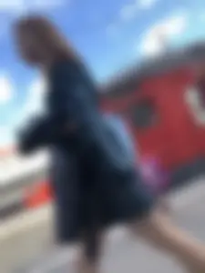 Cute candid girl in a dress at the train station