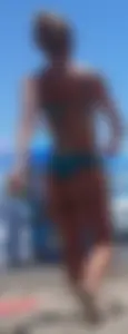 Sexy blonde on the beach in a teal thong bikini with nice ass