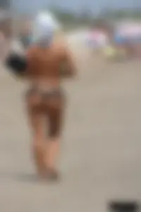 Tattooed blonde with big tits topless and in thong