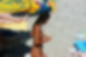 Ula FKK Sexy brunette on a nude beach topless, bottomless and with blue thong