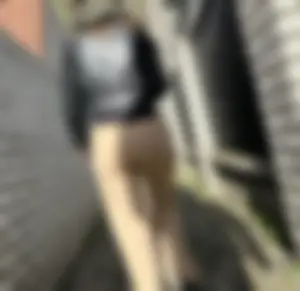 Girl in tight pants walking down a narrow suburban street creepshot, big hot ass