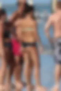 Beach girl out in a bikini with a nice round big booty