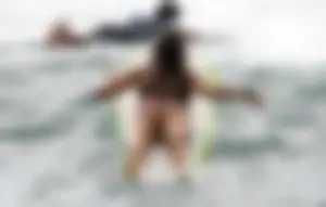 Beautiful hot surfer babe in bikini with a great ass