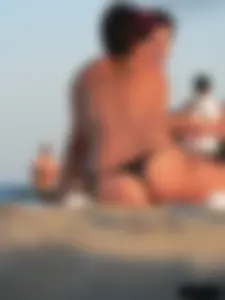 Sexy girls going topless at the beach showing off their sexy bodies